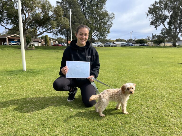 Happy woman with her dog after completing dog training at Agile Dogs.